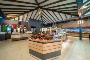 a bakery with many different types of food on display at Lykia Botanika Beach Fun & Club - All Inclusive in Fethiye