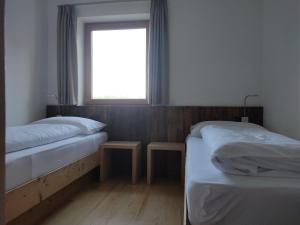 Posteľ alebo postele v izbe v ubytovaní Schartnerhof Ferienwohnung Lavendel