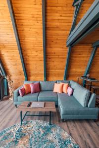 a living room with a couch and a table at Twins Bungalow in Sapanca