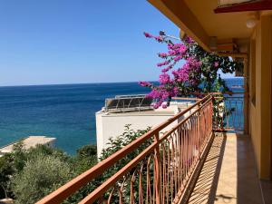 a balcony with a view of the ocean at Monterama Apartments in Sutomore