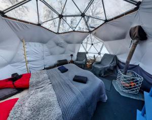 a bedroom with a bed in a tent at Aurora Dome in Kiruna