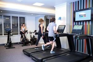 a group of people on treadmills in a gym at Aztec Hotel and Spa in Bristol