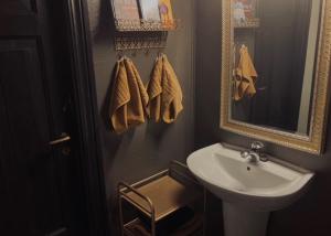 a bathroom with a sink and a mirror at Steinsvoll Gård in Vang I Valdres +46 photos
