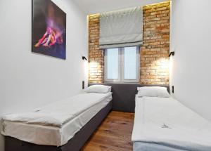 Postel nebo postele na pokoji v ubytování Imperial Apartments - Cassino Royal