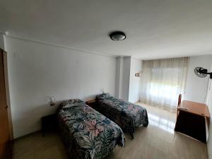 Postel nebo postele na pokoji v ubytování CA LAU