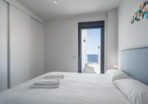 Postel nebo postele na pokoji v ubytování Blue Suite 2389 Sea Views