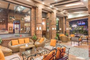 Uma área de estar em Dahlia Boutique Hotel