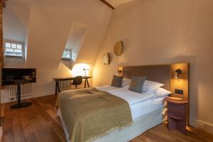 Postel nebo postele na pokoji v ubytování Romantik Seehotel Sonne