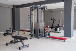a gym with several exercise equipment in a room at Lykia Botanika Beach Fun & Club - All Inclusive in Fethiye