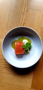 a white plate with a piece of food on a table at Parador 44 in Cardiff