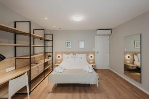 Posteľ alebo postele v izbe v ubytovaní Petit Luxe Volta Apartaments