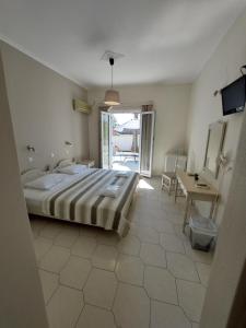 Postel nebo postele na pokoji v ubytování Alkyon Hotel