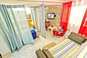 A television and/or entertainment centre at Milagros Central Apartments