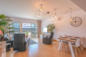 a living room with a table and chairs at Lucky Star Marina Apartment, with Pool in Lagos