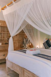 Postel nebo postele na pokoji v ubytování Mana Eco Retreat