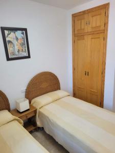 Posteľ alebo postele v izbe v ubytovaní Casa amplia adosada al lado de la playa