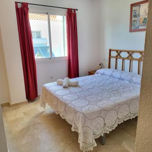 Posteľ alebo postele v izbe v ubytovaní Casa amplia adosada al lado de la playa