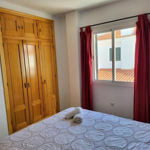 Posteľ alebo postele v izbe v ubytovaní Casa amplia adosada al lado de la playa