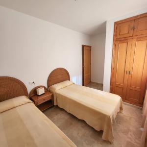 Posteľ alebo postele v izbe v ubytovaní Casa amplia adosada al lado de la playa + 21 fotografií
