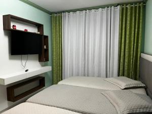 Gallery image of Apartamento de 3 quartos amplos na praia Pitangueiras, Guaruja in Guarujá
