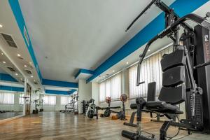 a gym with blue ceilings and tread machines at THE PARK HOTEL Formerly Al Jawhara Gardens in Dubai +17 photos