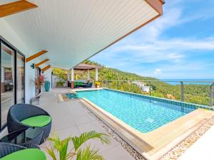 a villa with a swimming pool and a view at Villa AUREA Sea View in Koh Samui