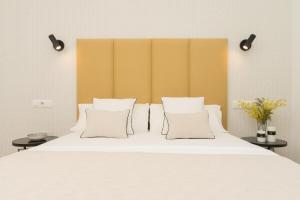 A bed or beds in a room at iloftmalaga Carretería - Puerta de Antequera