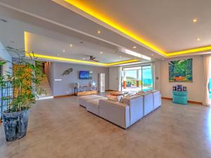 a large living room with couches and a tv at Villa AUREA Sea View in Koh Samui +35 photos