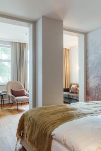 Postel nebo postele na pokoji v ubytování Romantik Seehotel Sonne