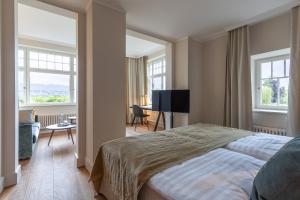 Postel nebo postele na pokoji v ubytování Romantik Seehotel Sonne