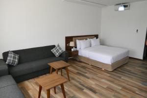Ένα ή περισσότερα κρεβάτια σε δωμάτιο στο Hôtel Corail de Cabo