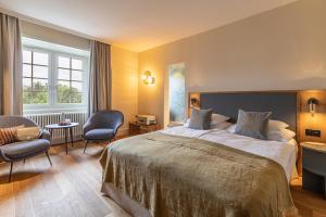 Postel nebo postele na pokoji v ubytování Romantik Seehotel Sonne