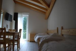 Posteľ alebo postele v izbe v ubytovaní Hotel Elbele Garnì