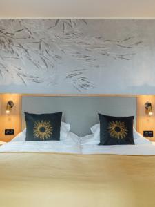 Postel nebo postele na pokoji v ubytování Romantik Seehotel Sonne