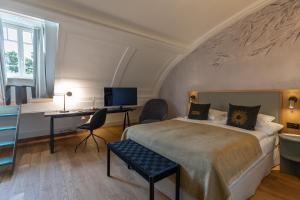 TV a/nebo společenská místnost v ubytování Romantik Seehotel Sonne