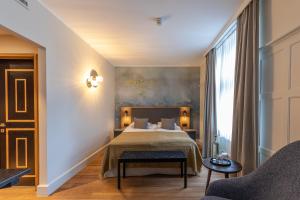 Postel nebo postele na pokoji v ubytování Romantik Seehotel Sonne