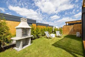 Zahrada ubytování RResort - Domki z KRYTYM i PODGRZEWANYM BASENEM, Sauna, WiFi, parking w cenie!