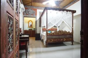 Postel nebo postele na pokoji v ubytování Okawati Boutique Bungalows