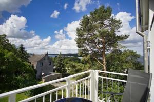 a view from the balcony of a house at moderne 2-Raum-Ferienwohnung mit Balkon - Ferienresidenz Zwei Bodden FeWo 1-4 in Lietzow