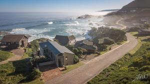 EersterivierstrandIgna的海滩与房屋和海洋的鸟瞰图