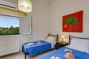A bed or beds in a room at Villa Terpsy by Villa Plus