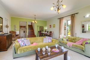 A seating area at Villa Terpsy by Villa Plus