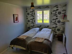 Säng eller sängar i ett rum på Husky Lodge Hostel