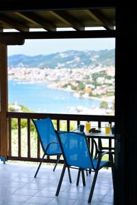 a table and chairs on a balcony with a view at Villa Katerina in Punta