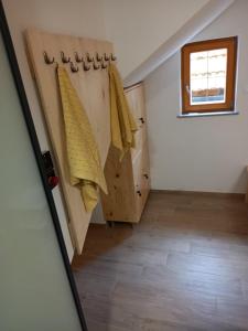 a hallway in a house with wooden doors and a window at Romantic Mountain Chalet and SPA Tubej in Bohinj +41 photos