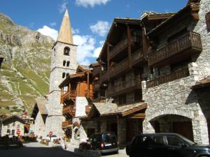 a building with a steeple and a church at White Paradise in Val dʼIsère