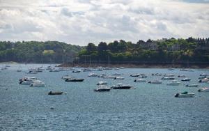 a large group of boats in a large body of water at Hôtel De La Vallée in Dinard