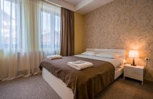 מיטה או מיטות בחדר ב-New Gudauri Suites N317