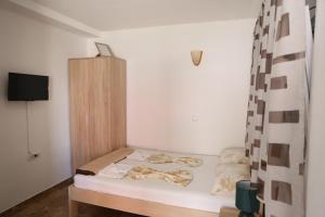 Postel nebo postele na pokoji v ubytování Friendly House