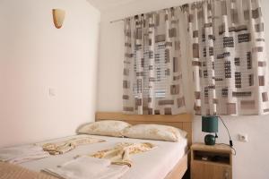 Postel nebo postele na pokoji v ubytování Friendly House